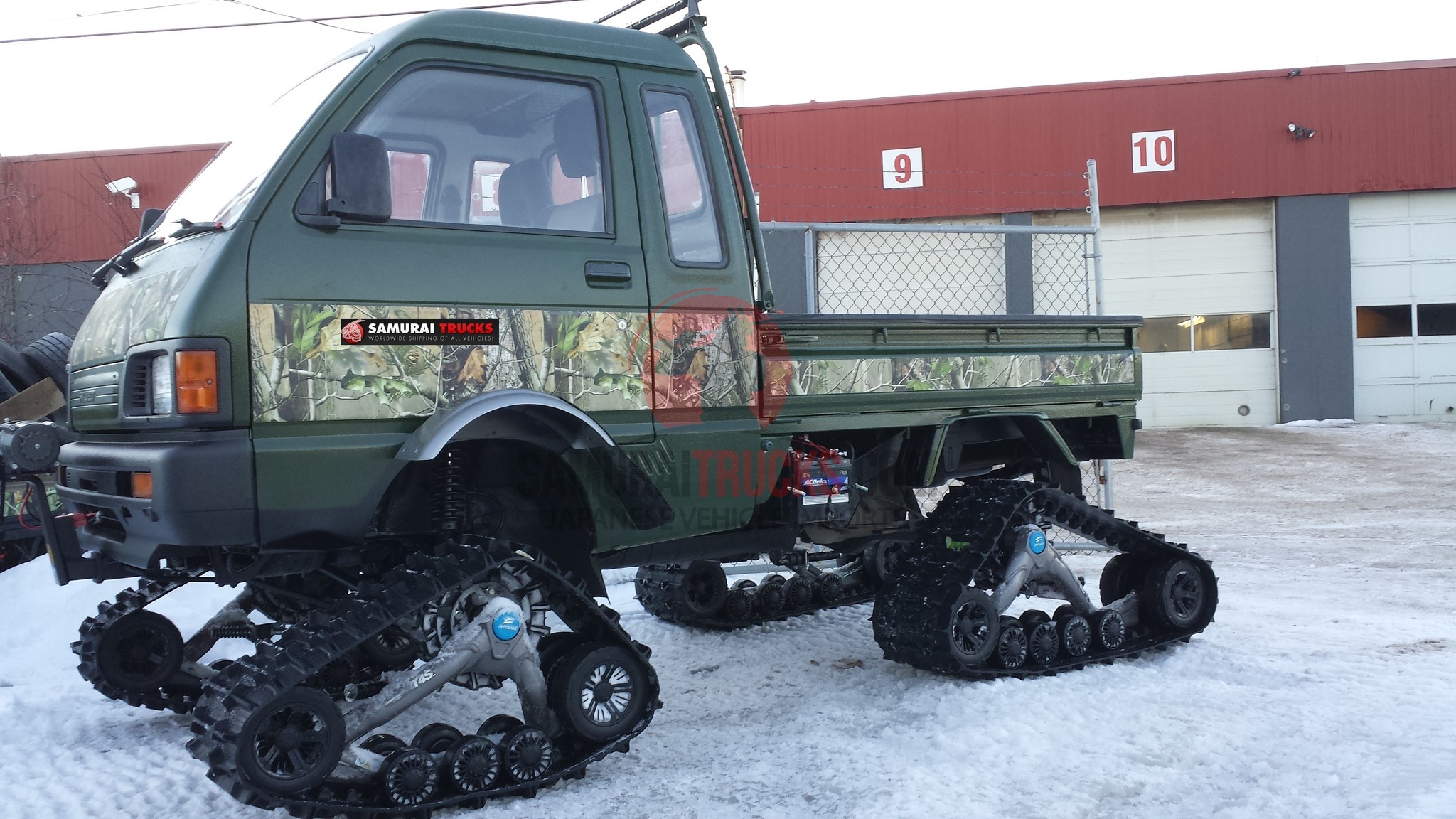 Tracked Daihatsu Hijet in camo wrap